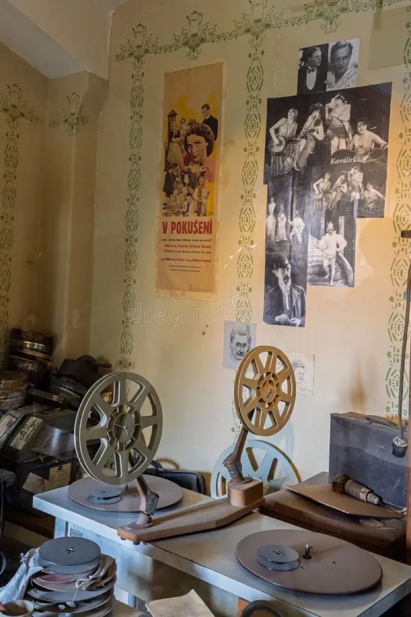 Film reels and vintage posters in the archive room